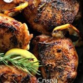 Crispy Skillet Chicken with crispy skin, roasted lemons and rosemary garnish