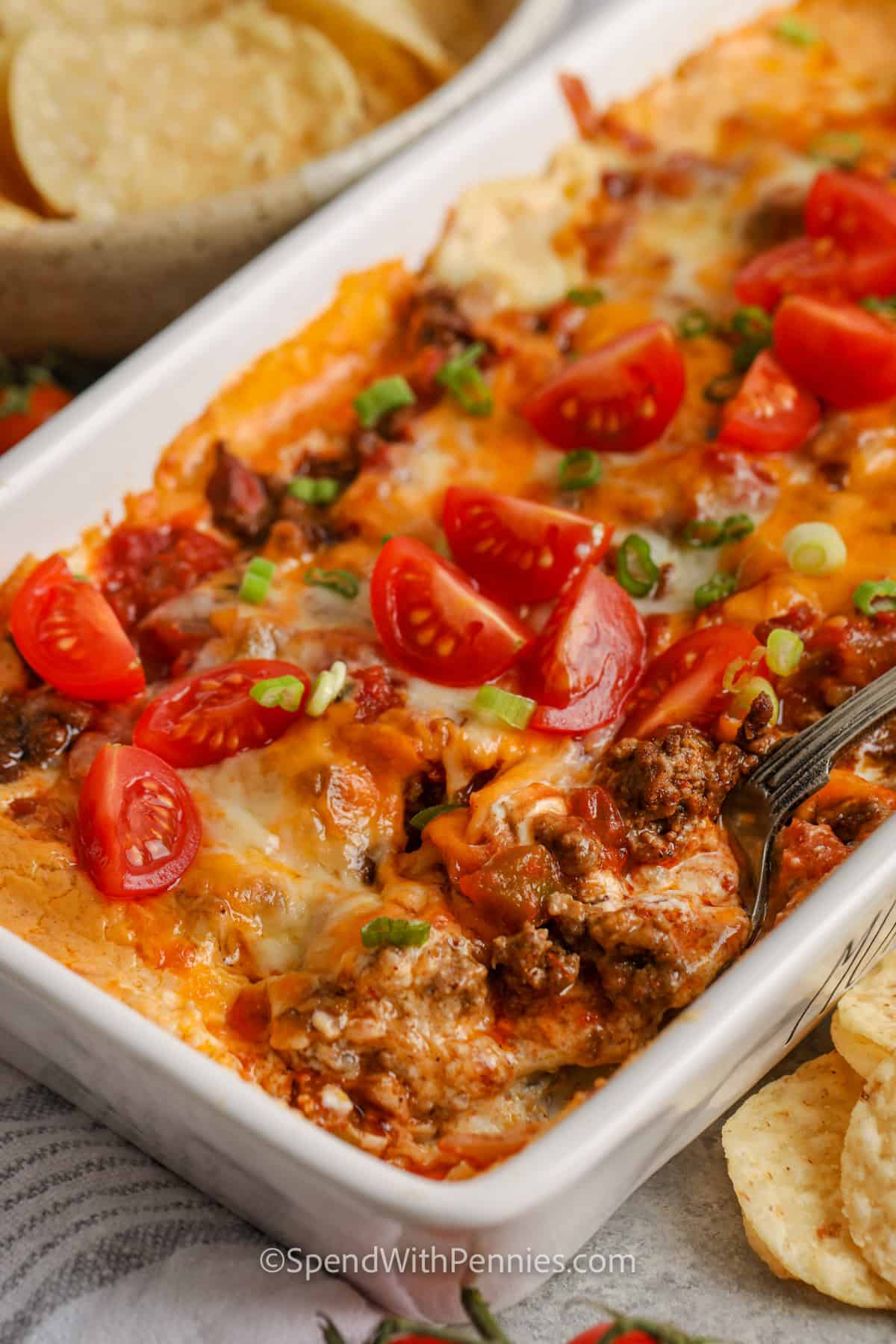 close up of Hot & Cheesy Taco Dip with a spoon