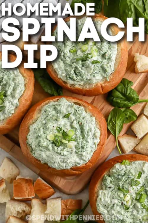 top view of Easy Spinach Dip in bread bowls with writing