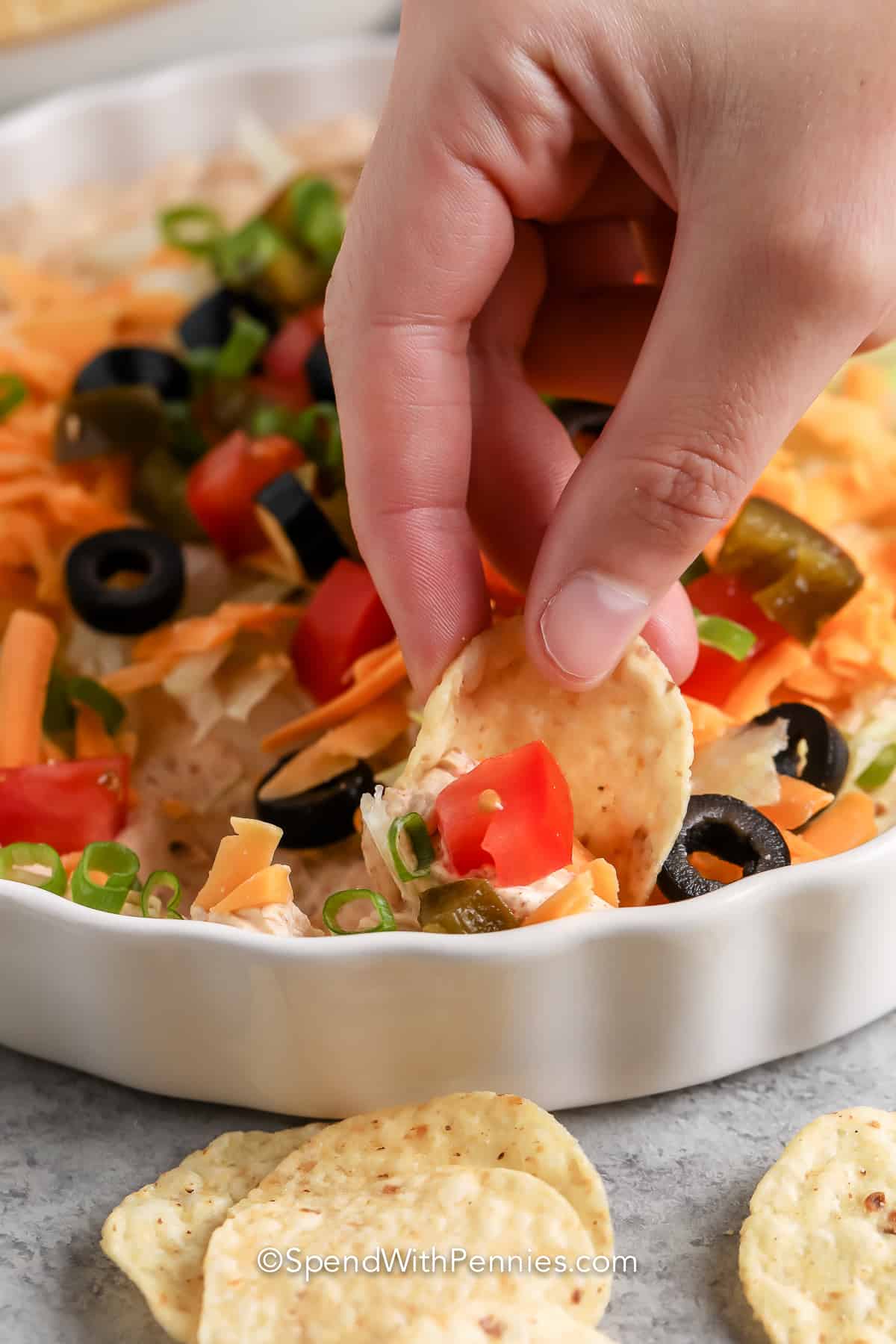 close up of chip dipped in Easy Taco Dip